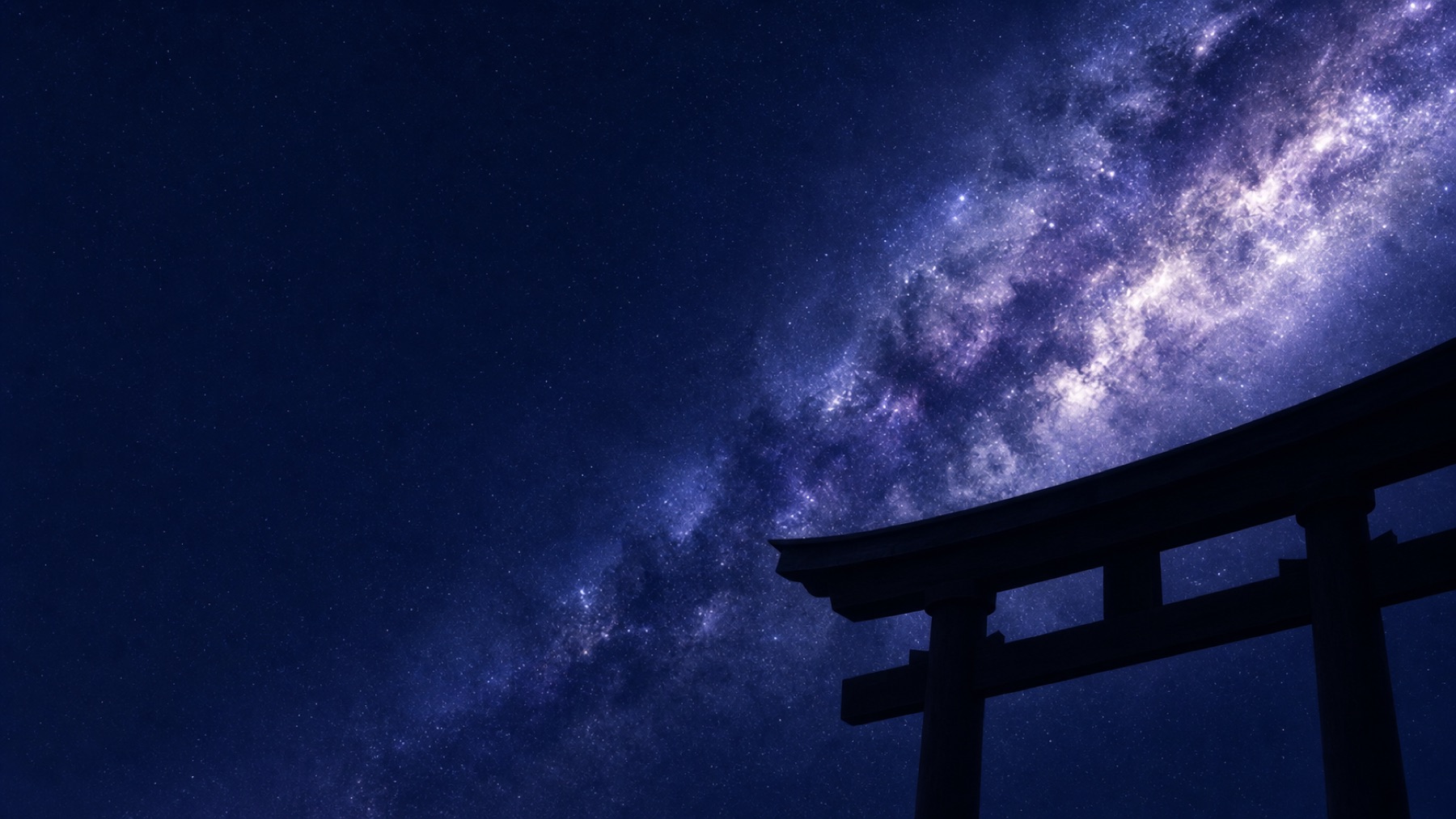 A torii gate standing under the Milky Way at night